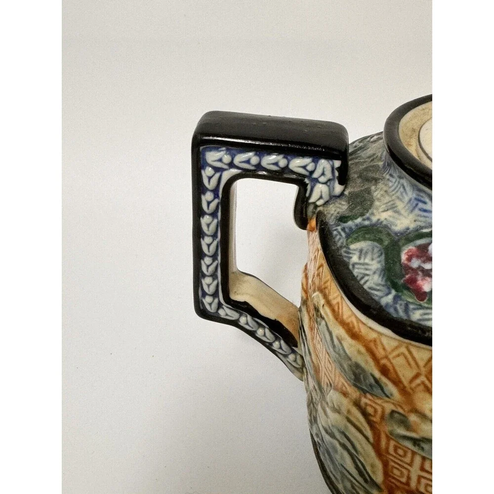 Teapot- vintage ceramic raised Asian  9 inches by 7 Inches